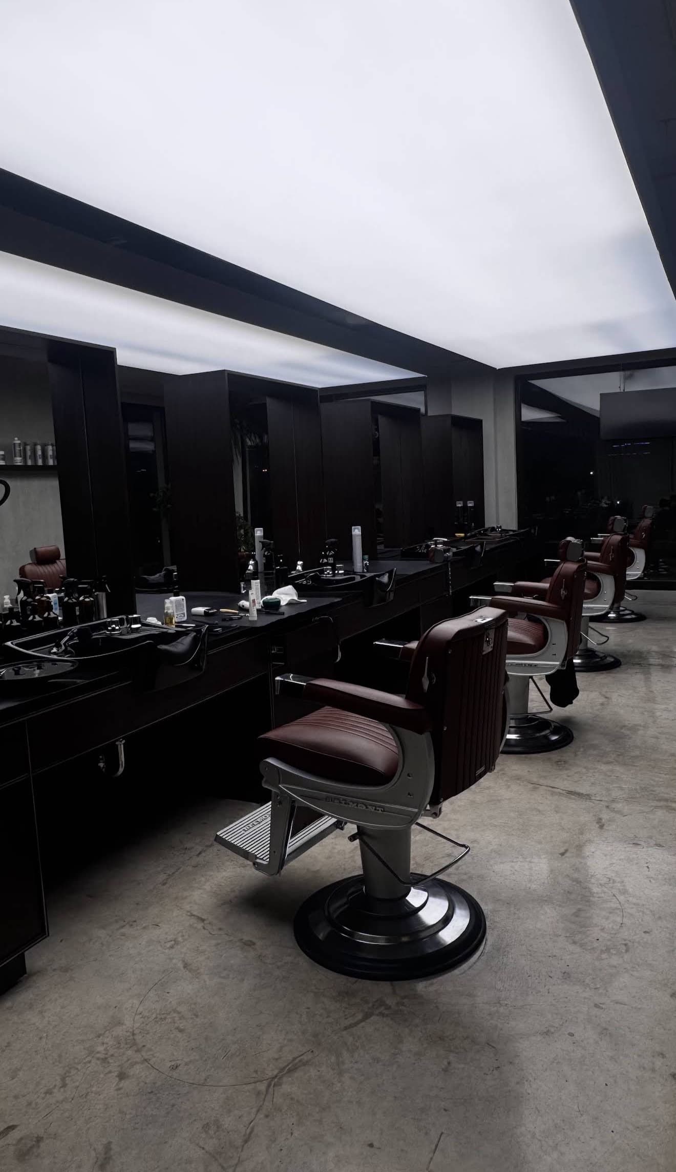 Barber chairs and mirrors on the Chops Barbers cutting floor